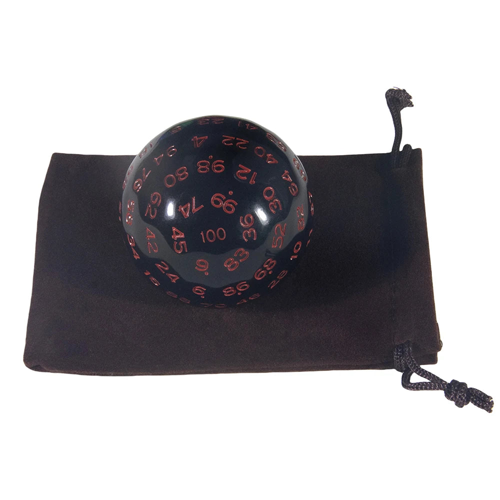 A black 100-sided polyhedral die resting in a dark brown storage bag.