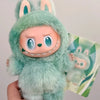 A soft mint green Labubu vinyl plush pendant featuring large ears and a smiling expression.
