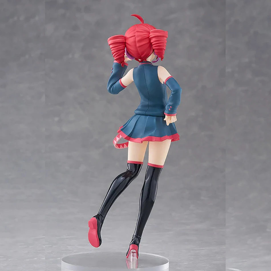 A PVC figure of Hatsune Miku with red hair and a blue outfit standing on a clear base.