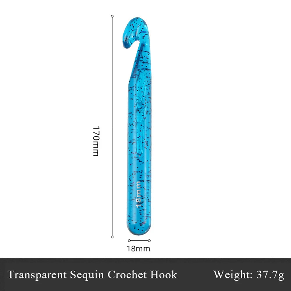 A single transparent sequin crochet hook is shown vertically against a white background.