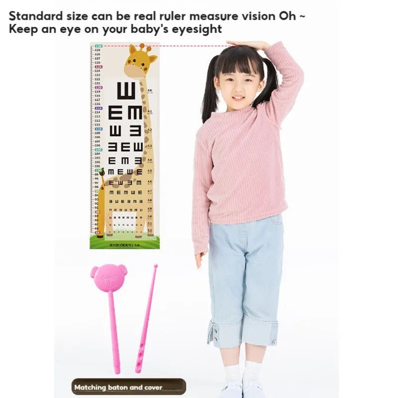 A young girl is holding a pink sweater and light blue pants, demonstrating the standard size of a ruler toy.