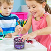 A young girl is playing with purple slime putty in a jar while a boy watches nearby.