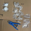 A kit containing squishy stress relief balls, plastic bags, and a blue tool for customization.