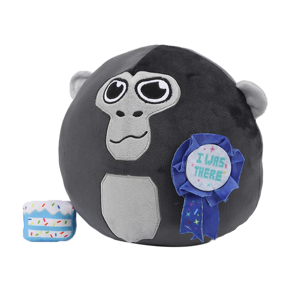 A black and gray gorilla plush toy with large eyes and a blue ribbon featuring the text I WAS THERE