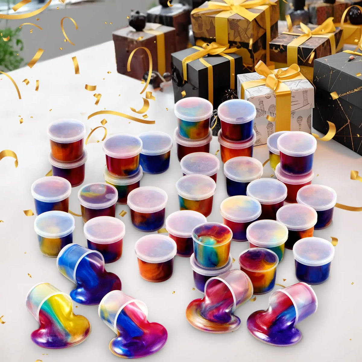 A collection of colorful, iridescent slime party favors in small cups and squeezable toys.