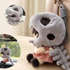 A gray dinosaur skeleton bag charm with a removable hood and soft fabric texture.