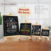 A set of three mini wooden chalkboard easels with vintage lettering for desktop display