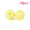 Two yellow silicone beads are shown against a white background, indicating a set of soft beads for jewelry making.