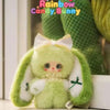 A fluffy green bunny plush toy with white accents and a bow, part of the Rainbow Candy Bunny series.