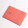 A pink leather card holder wallet featuring a silhouette of a cartoon superhero cat's face.