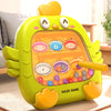 A bright yellow, squishy-looking puzzle board shaped like a cartoon character with magnetic color and number matching holes.