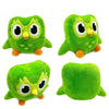 A set of four plush owl toys in various shades of green and yellow.