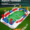 A competitive match football game featuring building blocks and a field setup for tabletop play.