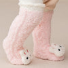 Pink coral velvet baby knee-high socks with white trim and cute animal feet