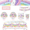 A collection of unicorn party supplies including a unicorn face, colorful decorations, and various paper items for a birthday