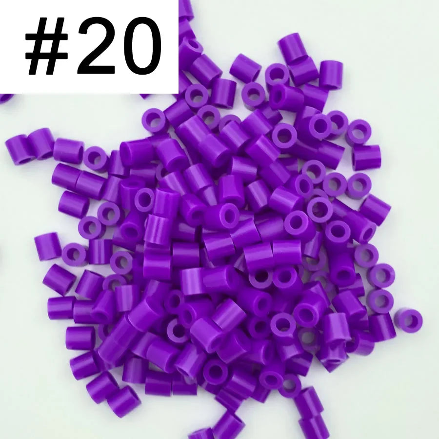 A pile of 1000 small purple fuse beads for creative craft projects.