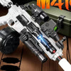A white electric gel blaster gun with a black and silver finish is shown on a wooden surface.