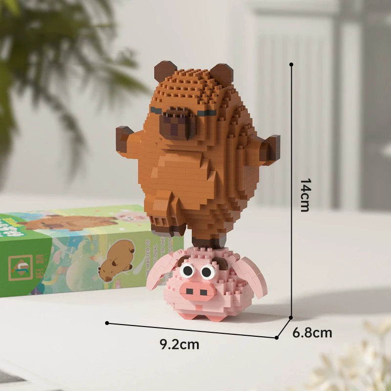 A small, detailed building block model of a brown capybara standing on a pink base.