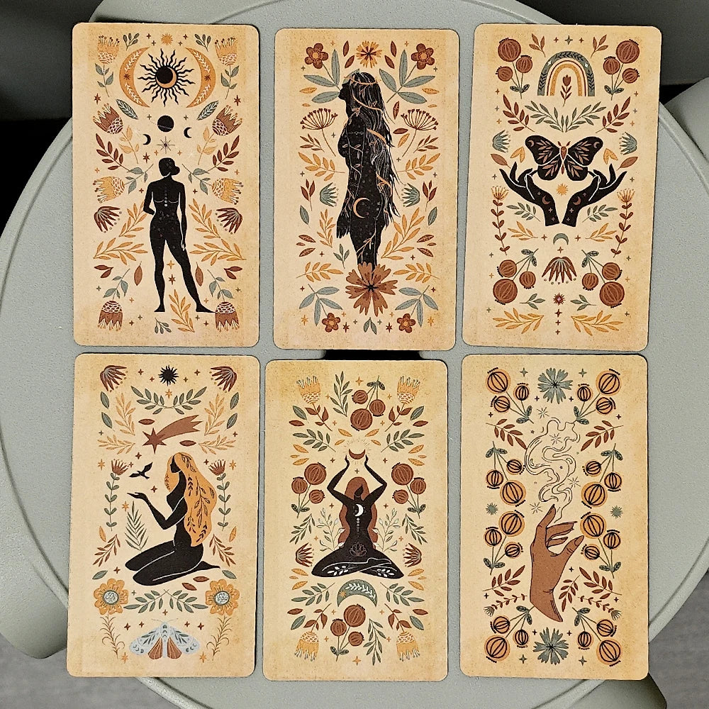 A set of ten inspirational oracle cards featuring mystical imagery and earthy tones arranged on a light gray surface.