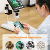 A woman is using a portable digital microscope to examine small animals, repair PCBs, jewelry, and textiles.