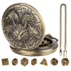 A brass steampunk dragon pocket watch dice case with seven small wooden dice.