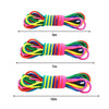 A set of colorful rainbow elastic jump rope training bands of varying lengths, laid out horizontally.