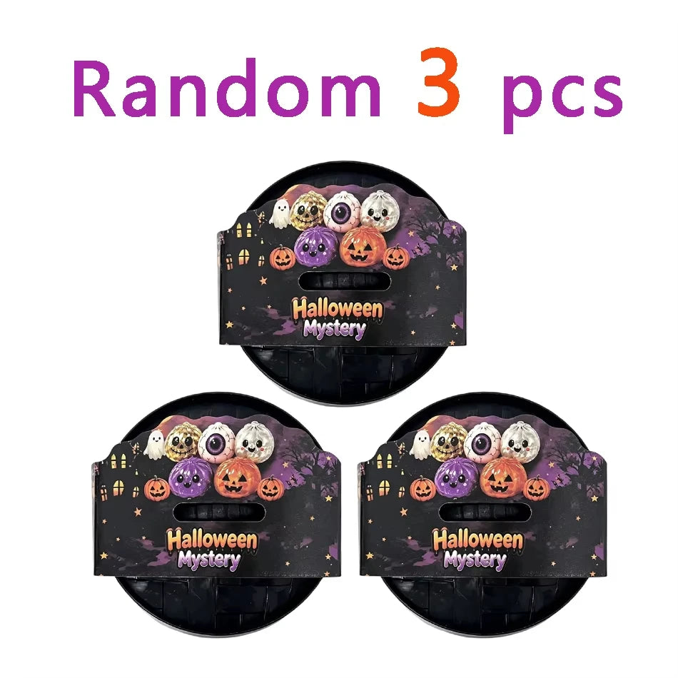 Random 3 pcs Halloween Mystery set of squishy fidget toys including glitter pumpkin, eyeball, and skull stress relief balls