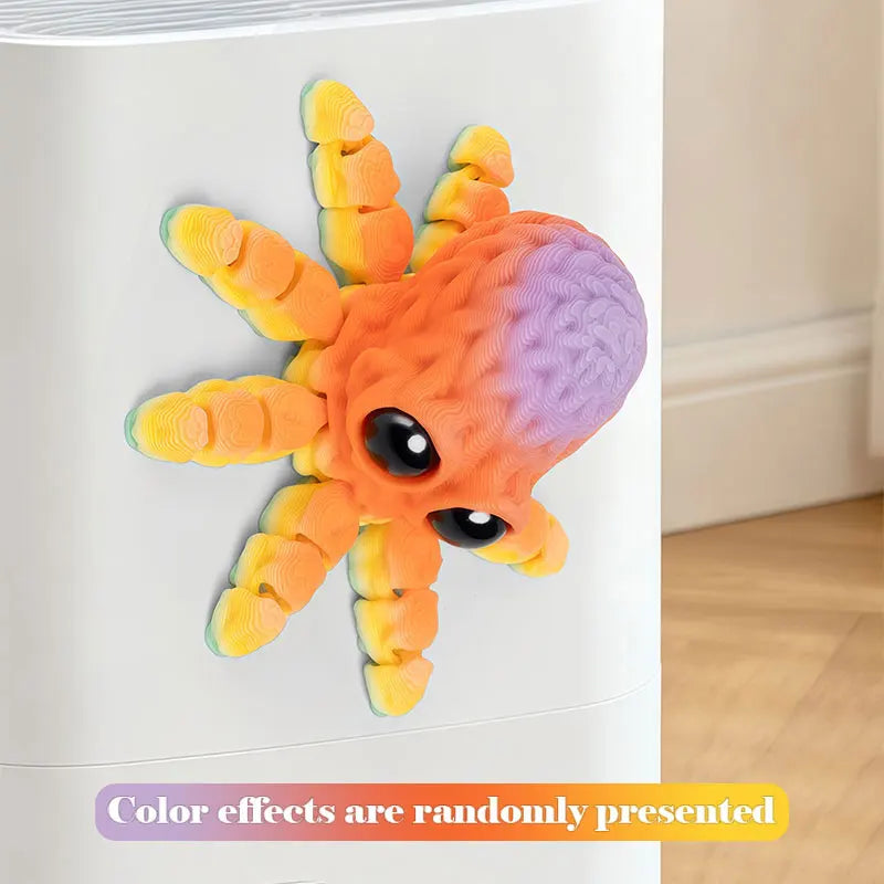 A colorful 3D printed articulated octopus fridge magnet with orange and purple hues.