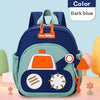 A dark blue kids cartoon digger truck backpack with orange accents and a green fabric on a light pink background.