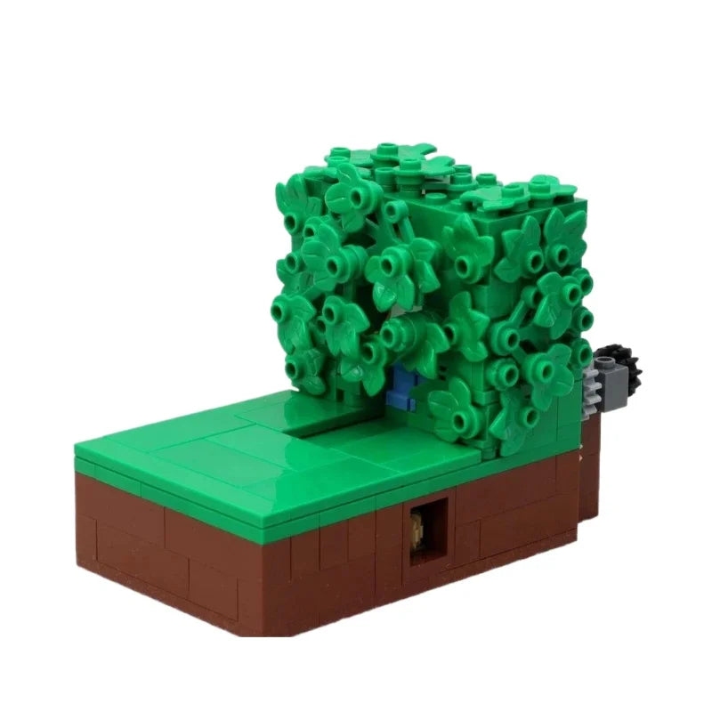 A LEGO building block model of Homer in the bushes scene featuring green foliage and a brown base.