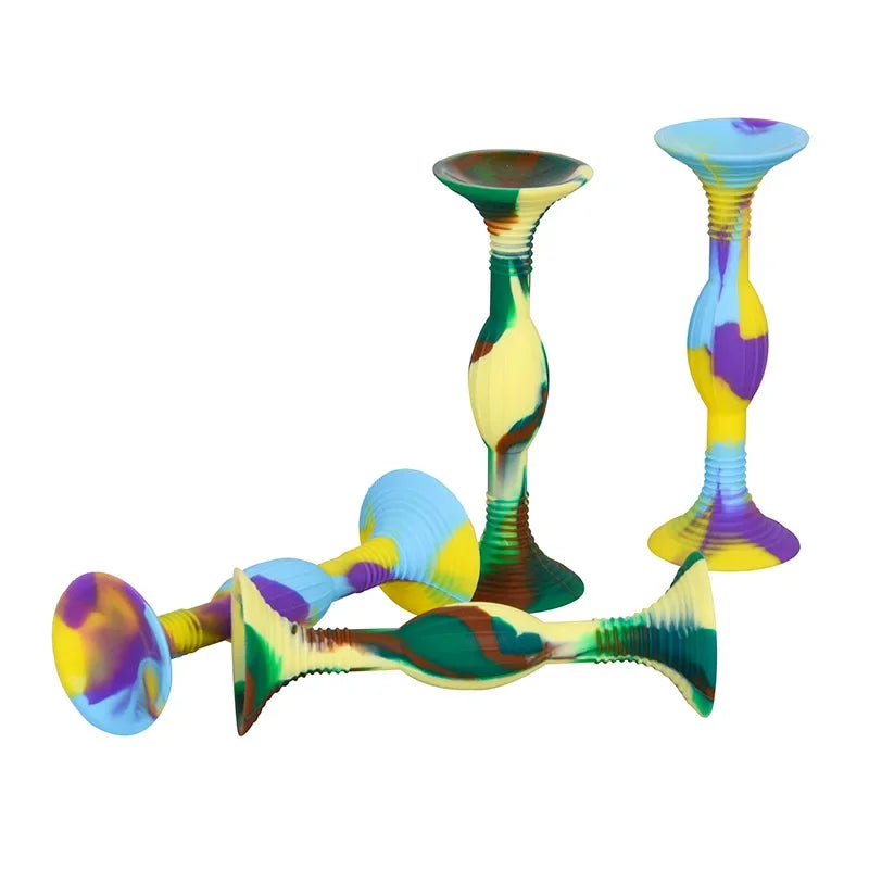 A set of colorful silicone suction cup darts featuring yellow, green, and purple hues.