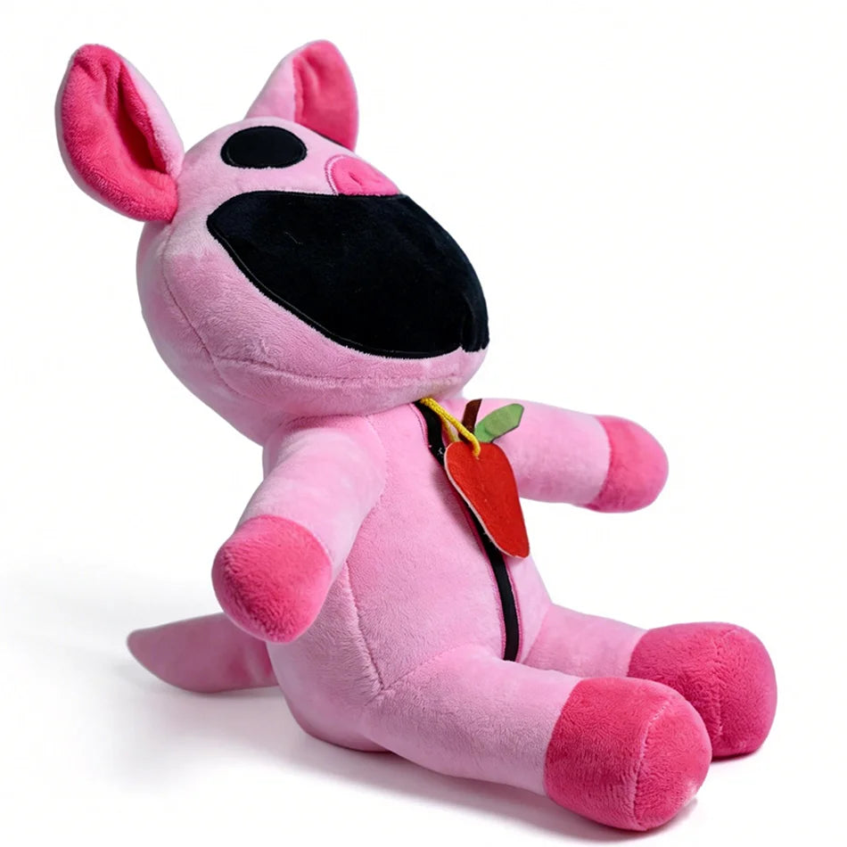 A pink plush doll resembling a cat with large ears and a black muzzle, featuring a red apple accessory.
