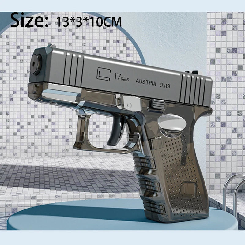 A silver high-power water blaster gun is displayed on a surface.