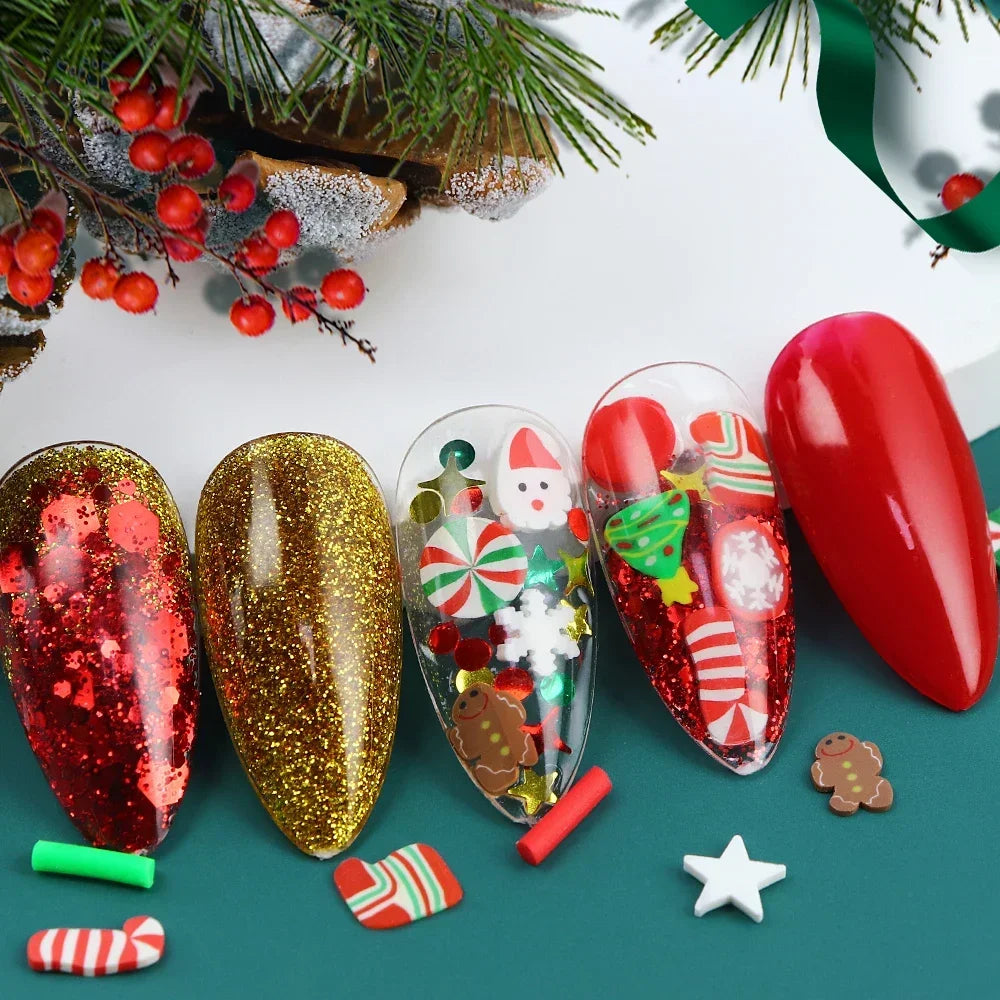 Red and gold festive Christmas polymer clay slices for resin crafts displayed on a green surface with pine branches.