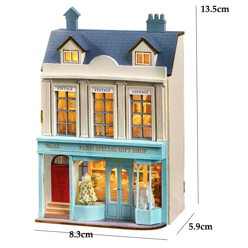 A detailed wooden dollhouse kit of a pink princess villa with architectural features and glass display windows.