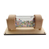 A wooden sensory learning toy featuring a clear tube filled with colorful beads for toddlers.