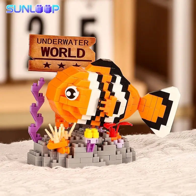 An orange and black shark model built from LEGO-style blocks, displayed on a white surface.
