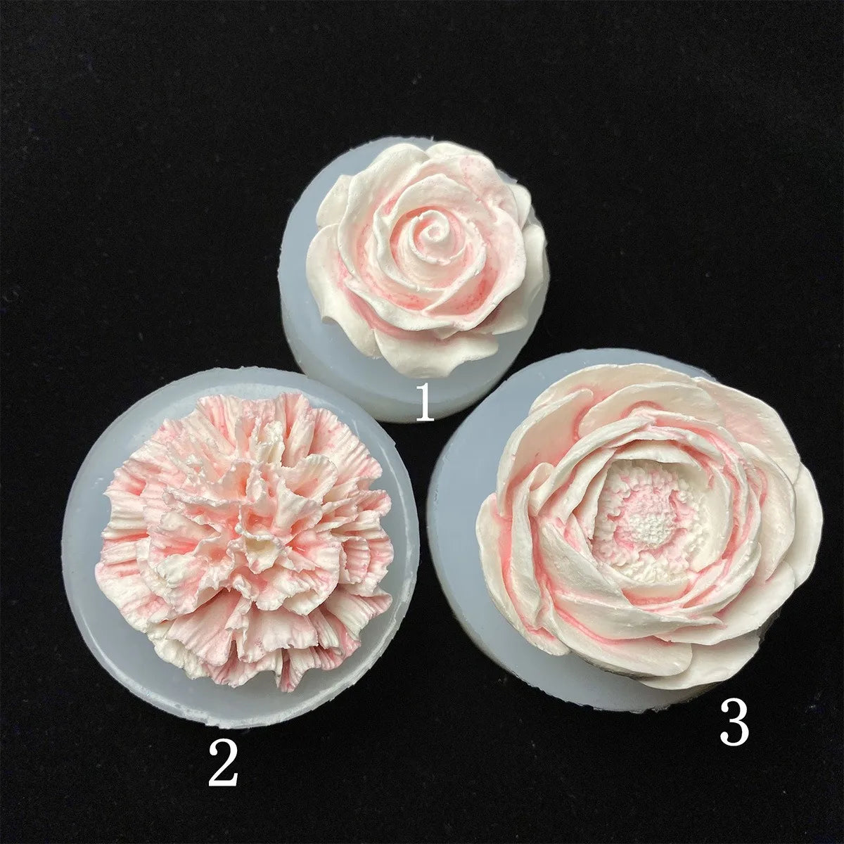Three silicone molds showing various shades of pink and white floral roses for candles, soap, and baking.