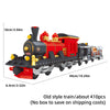 A red and black vintage steam train building blocks set with detailed carriages.