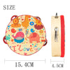 A round wooden tambourine with a cartoon design featuring an elephant and other colorful elements.