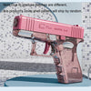 A pink high-power water blaster gun is shown on a light blue surface.