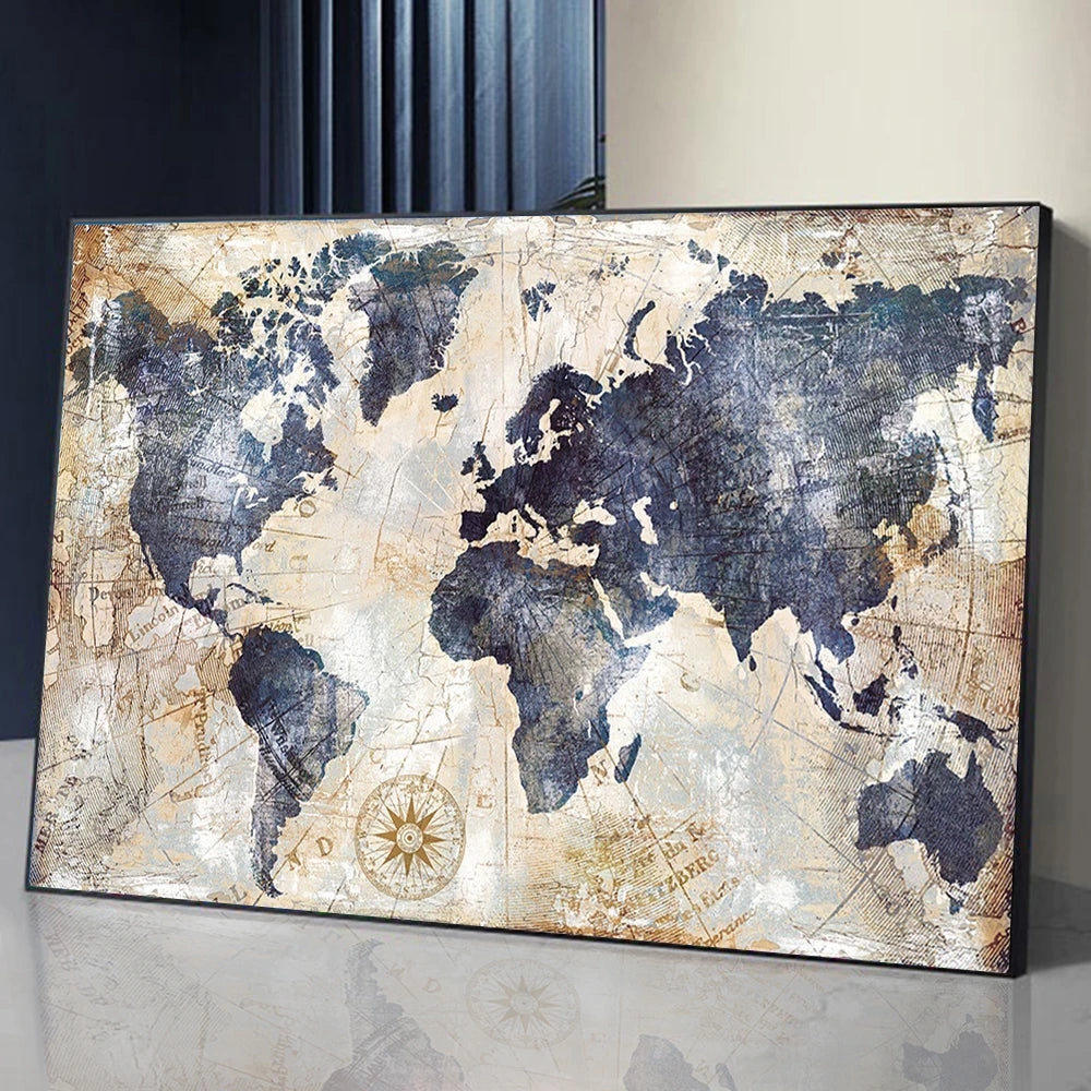 A framed map of the world in distressed tones, featuring blue and white textures.