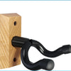 A black, curved wall mount hanger made of metal is attached to a wooden block.
