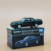 A Tomica Nissan Skyline GTS-R sports car model in dark blue is displayed on its packaging.