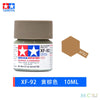 A bottle of Tamiya color yellow-brown acrylic paint, model kit paint, labeled XF-92, 10ml.