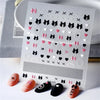Sheet of 5D bronzing gothic nail art stickers featuring various black and pink floral and geometric designs