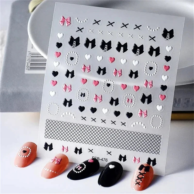 Sheet of 5D bronzing gothic nail art stickers featuring various black and pink floral and geometric designs