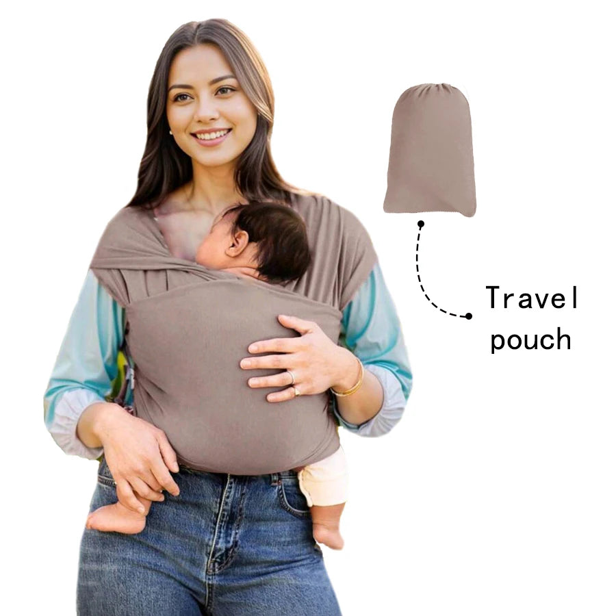 A woman is holding a baby in a brown knitted fabric multi-functional baby carrier with a separate travel pouch.