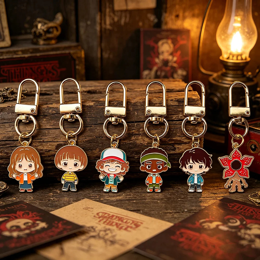 A set of six metal keychains featuring character pendants from Stranger Things.