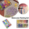 A watercolor painting set featuring a travel tin, loose paints, and a palette of vibrant colors.